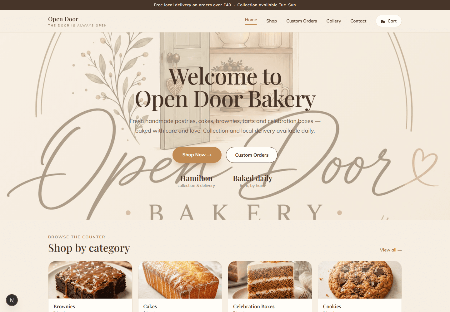The Open Door Bakery home page: a watercolour hero reading Welcome to Open Door Bakery, buttons to shop and to order something custom, and a row of category cards.
