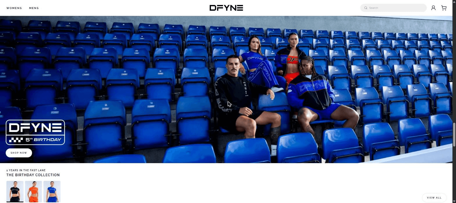 The same hero section carrying a different campaign: four athletes in blue sitting in a stadium, a DFYNE 5th Birthday lockup, and a Shop Now button.
